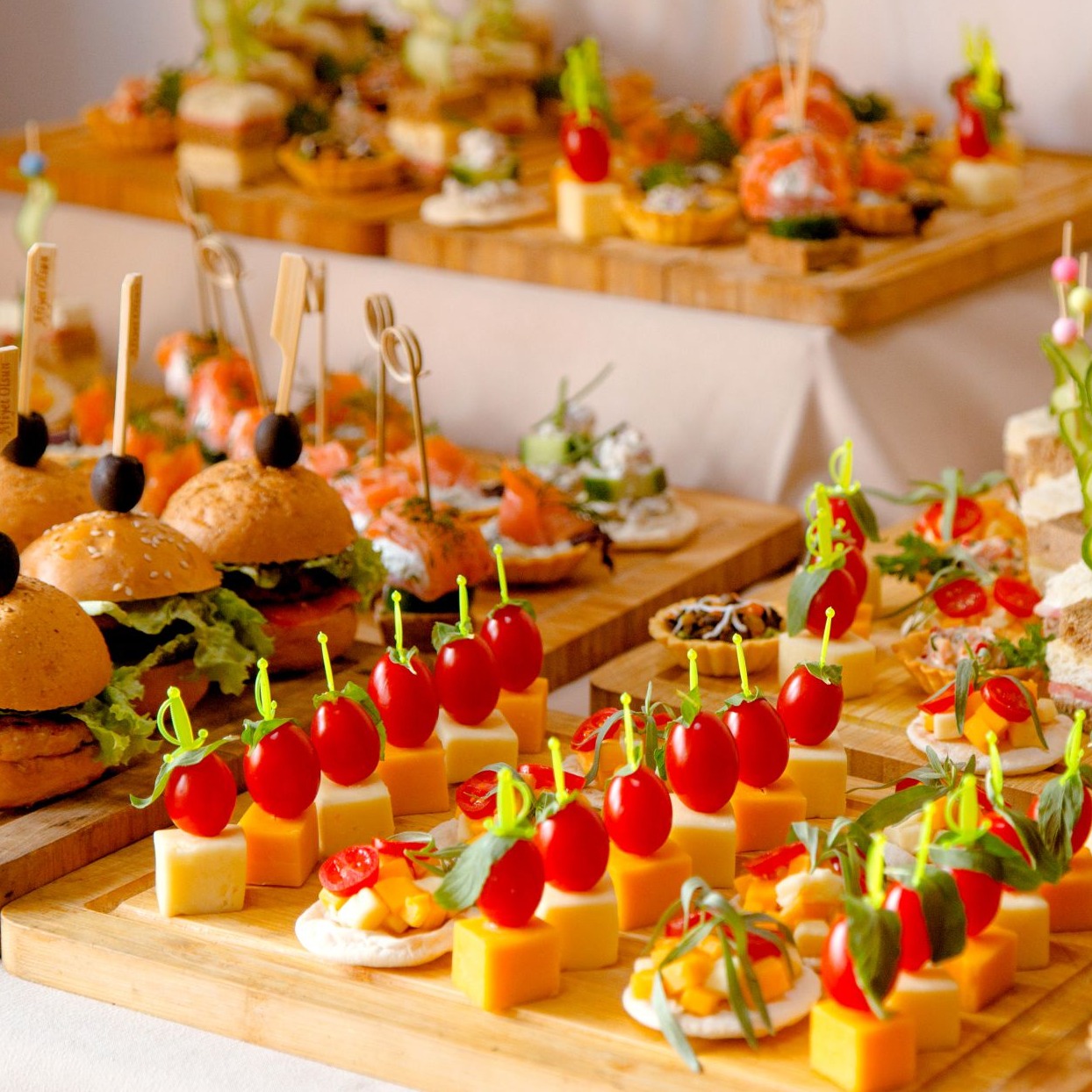 A photorealistic image of a beautifully arranged lunch table featuring a variety of delicious Slovak dishes such as stuffed peppers, goulash, and fresh salads. Include elegant dining utensils and a vibrant setting with natural light.